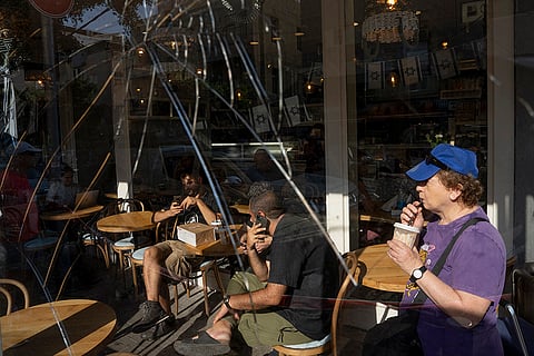 Broken coffee shop window after drone attack
